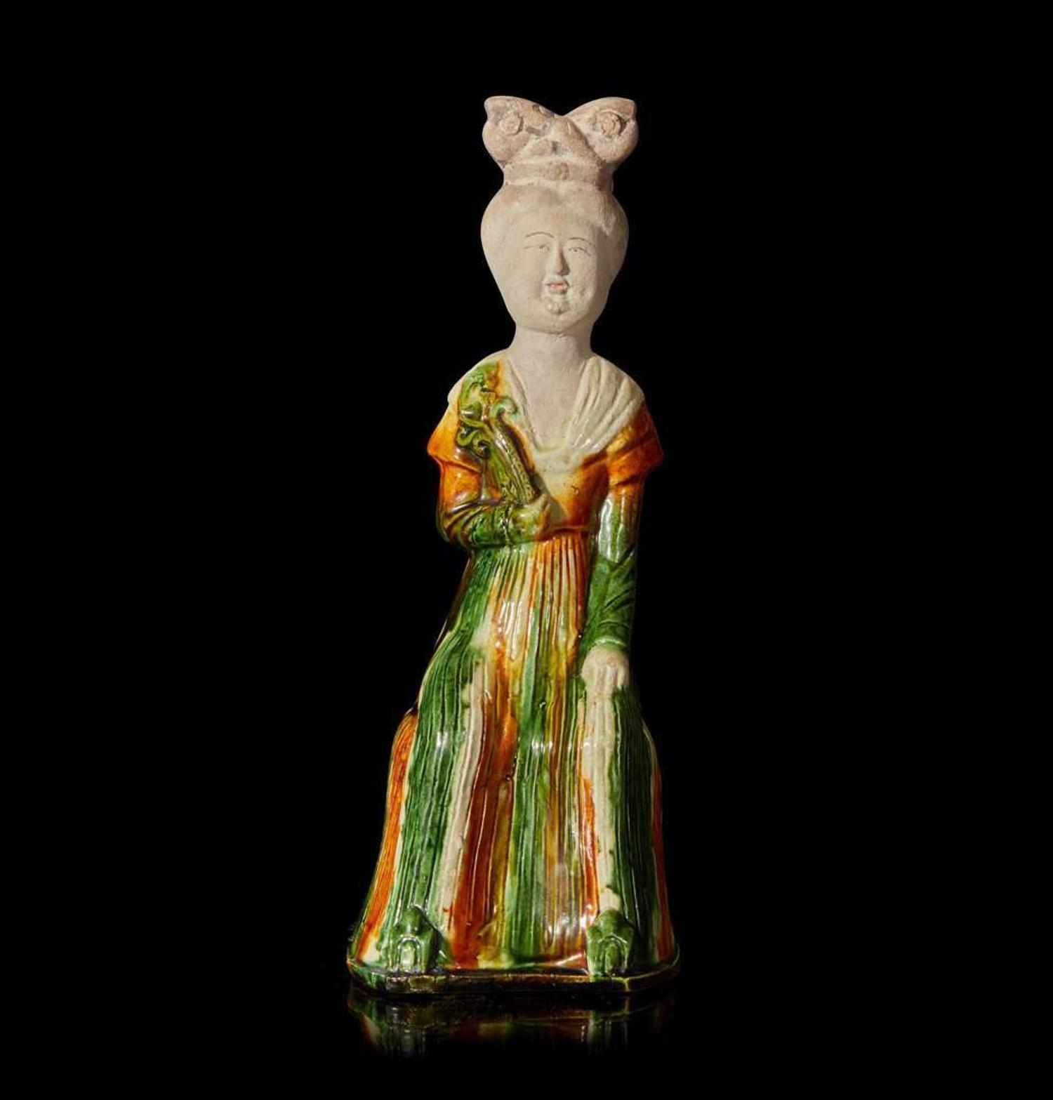 A Chinese sancai-glazed pottery figure of a seated woman 唐三彩仕女坐像 Tang dynasty ?