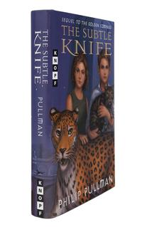 PULLMAN, Philip. [His Dark Materials trilogy:] The Golden Compass . — The Subtle Knife . — The Amber Spyglass . New York: Alfred A. Knopf, 1996-1997-2000.
