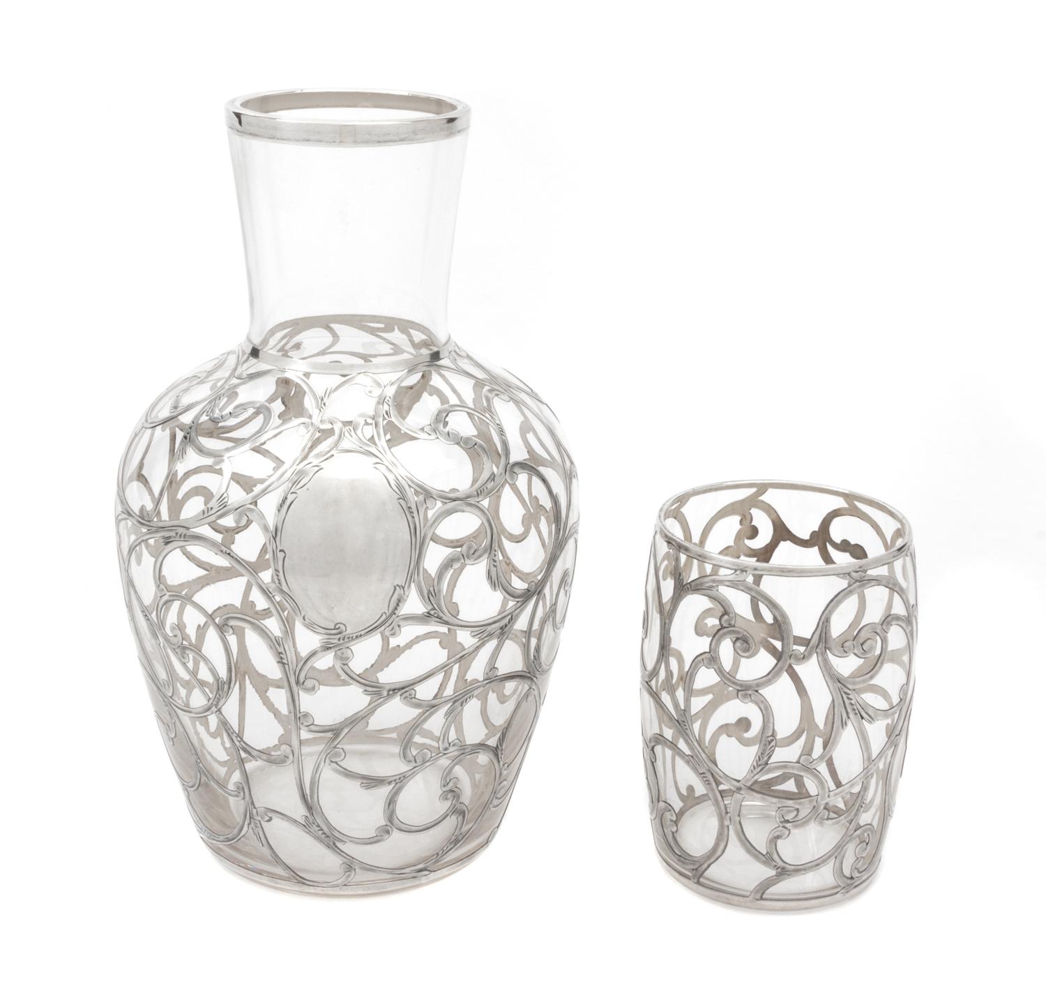 A Silver Overlay Glass Tumble Up Height of tallest 17 inches.