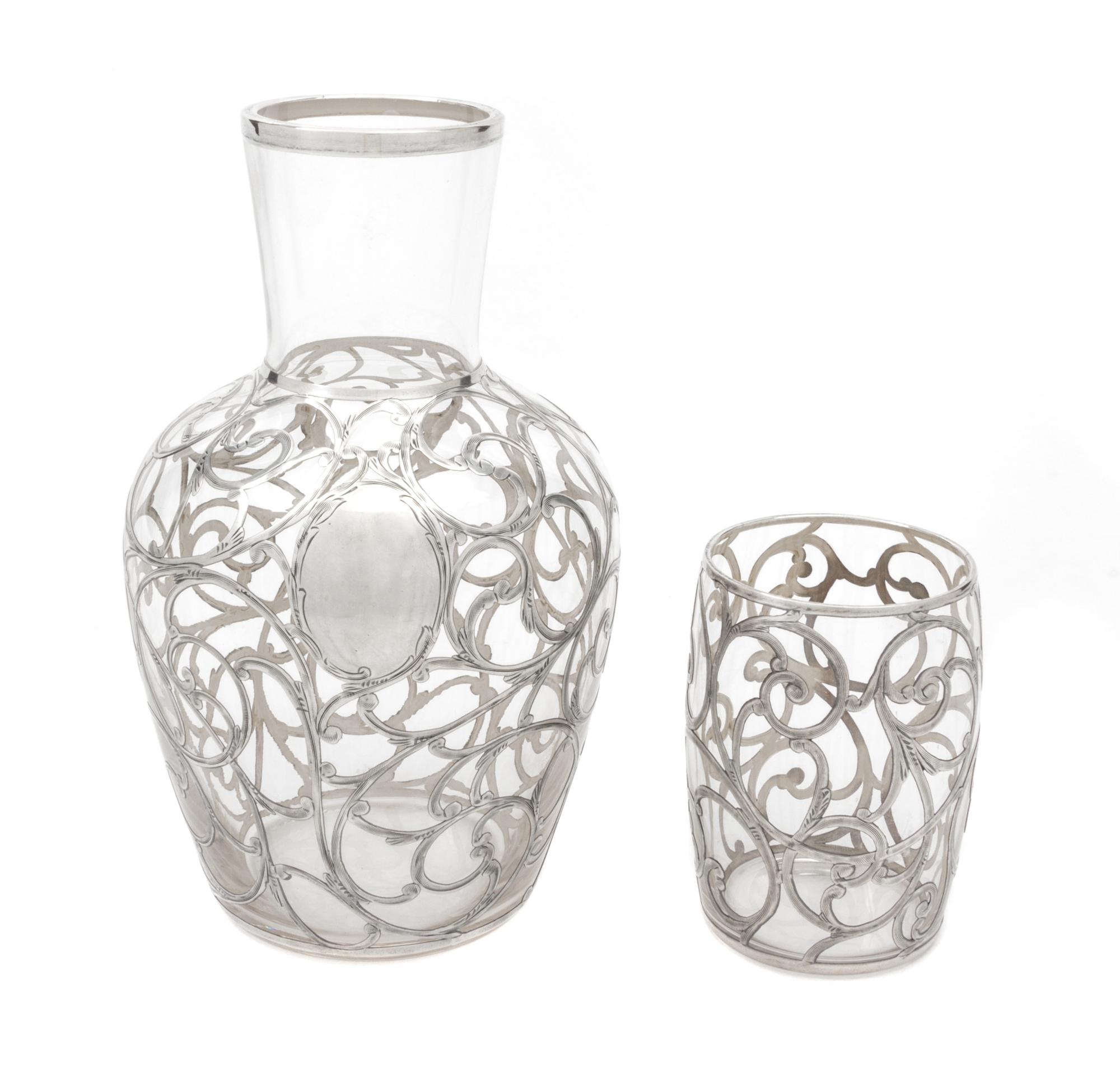 A Silver Overlay Glass Tumble Up Height of tallest 17 inches.