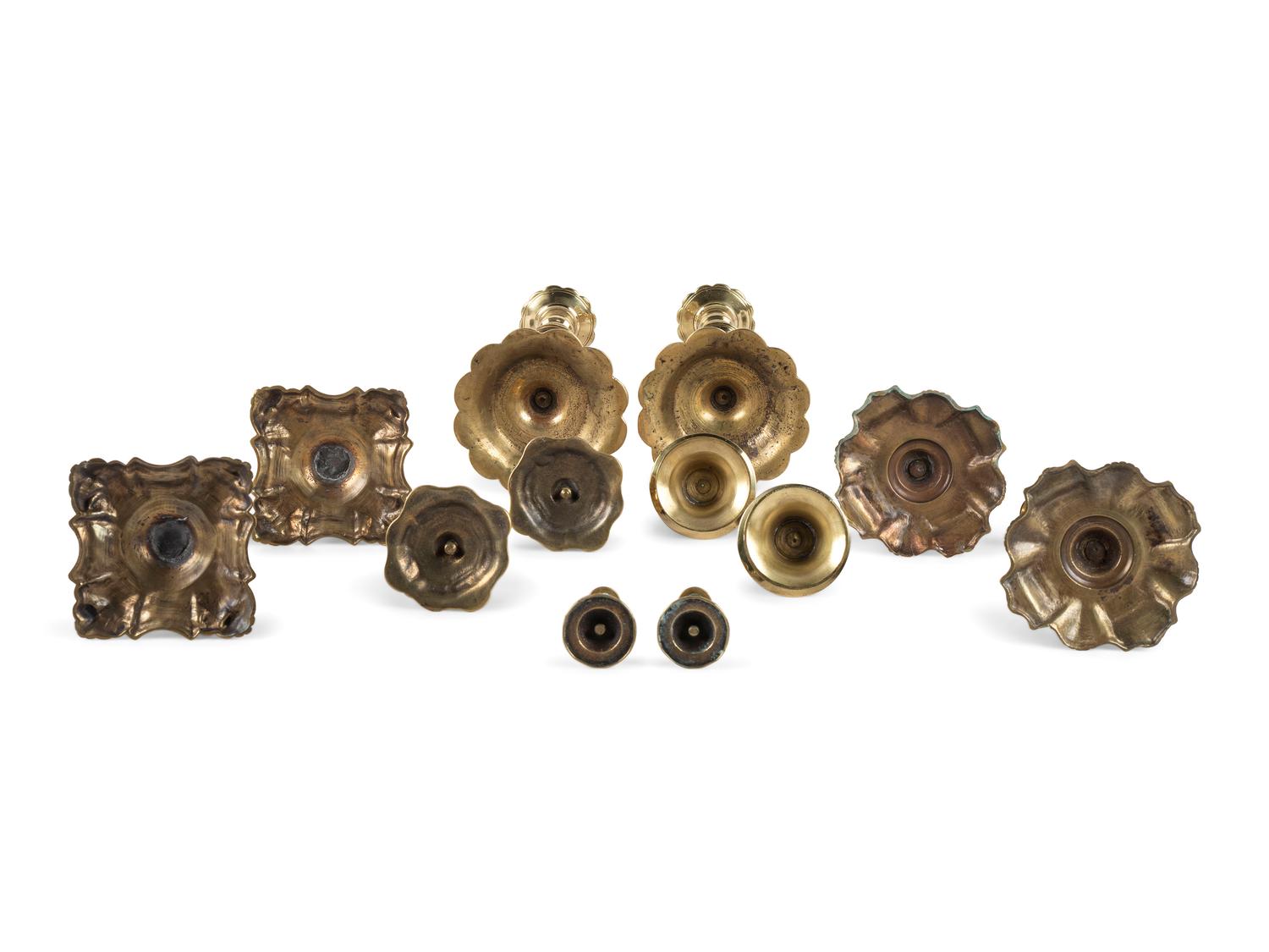 A Group of English and German Brass Candlesticks