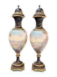 A Pair of Sèvres Style Gilt Bronze Mounted Porcelain Urns