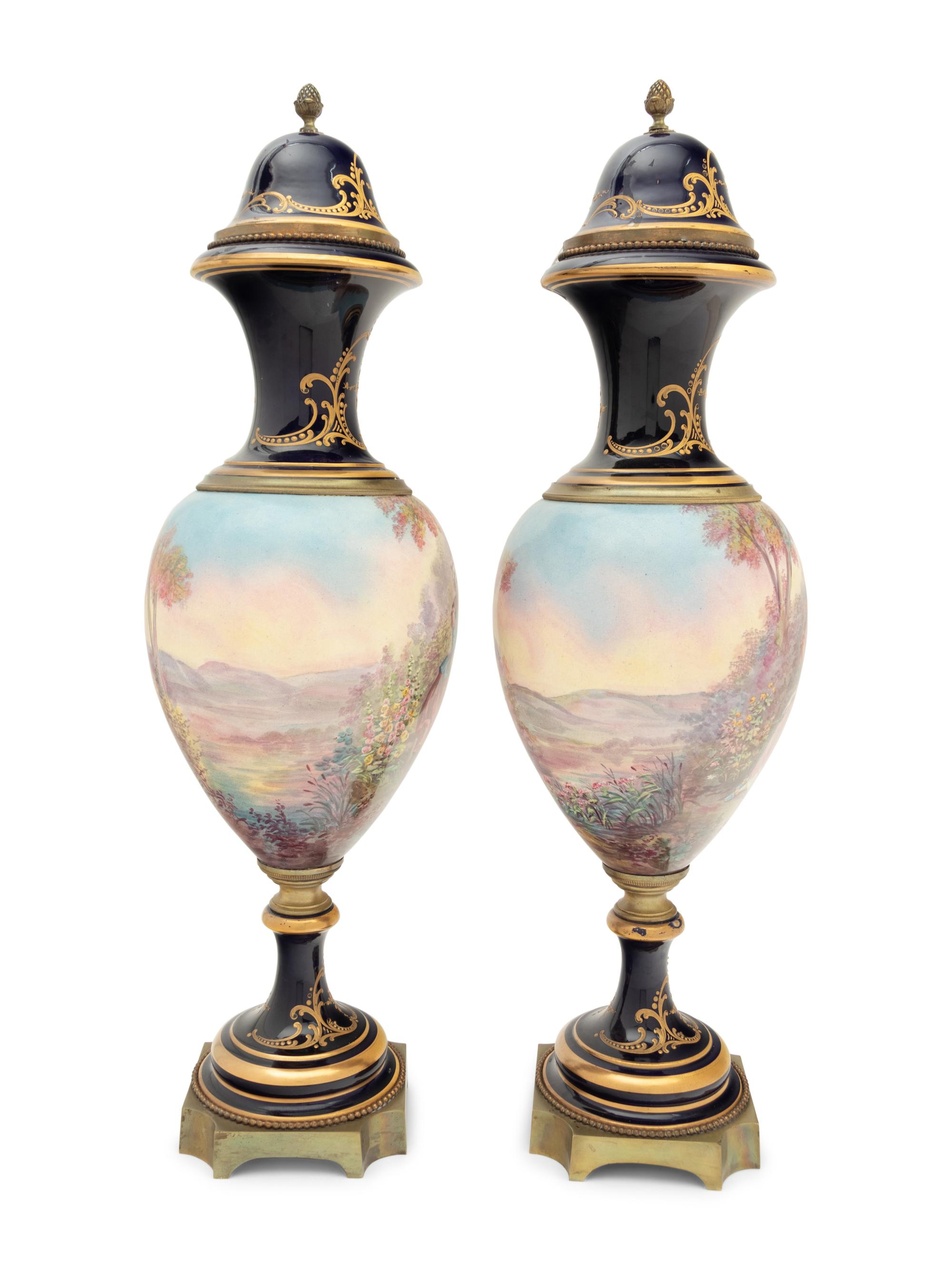 A Pair of Sèvres Style Gilt Bronze Mounted Porcelain Urns