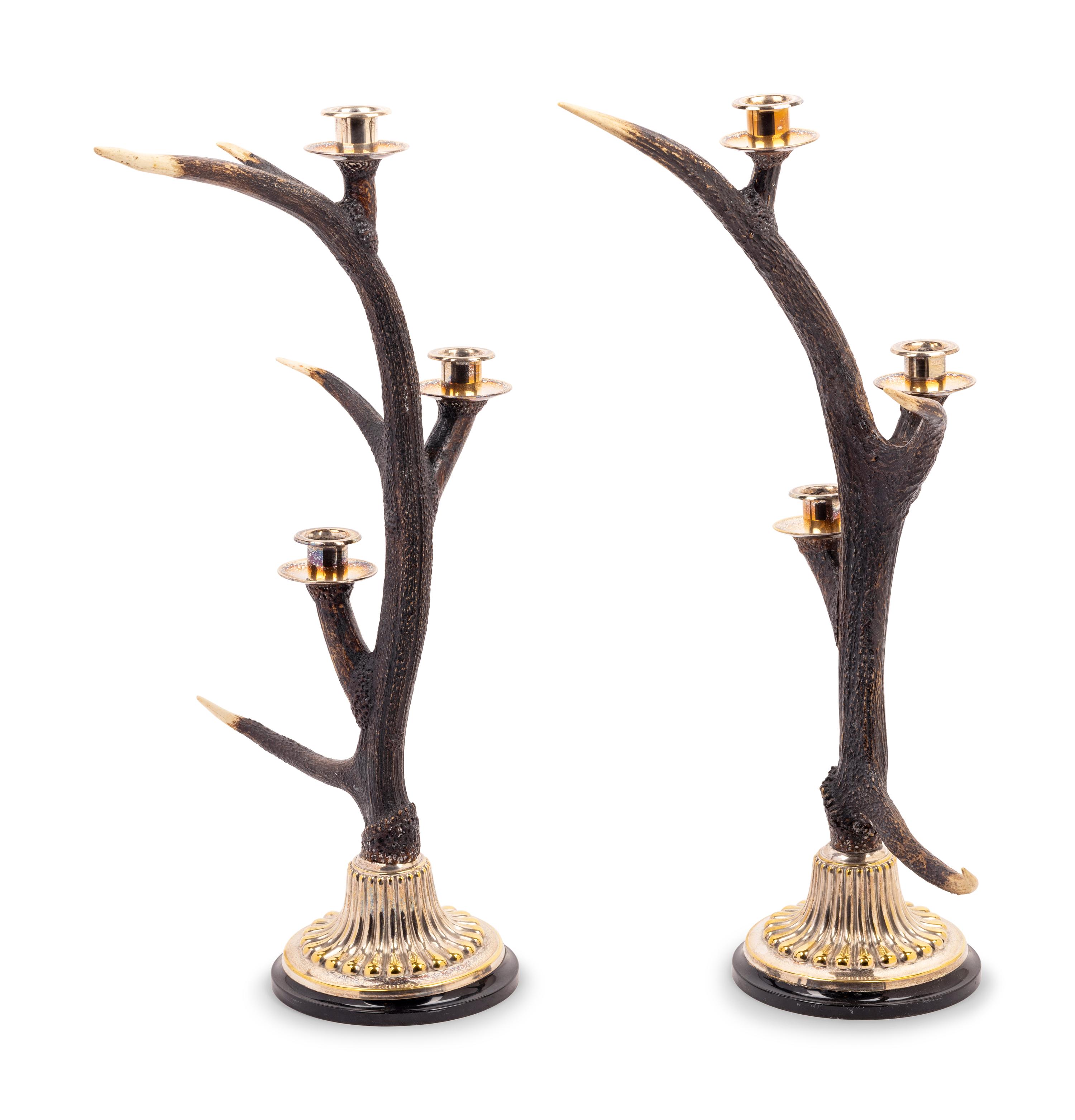A Pair of Silvered Metal Mounted Antler Three-Light Candelabra