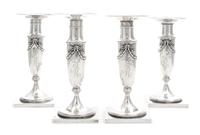A Set of Four American Silver Candlesticks, Whiting Mfg. Co., New York, NY, each baluster stem with applied bellflower garlands.