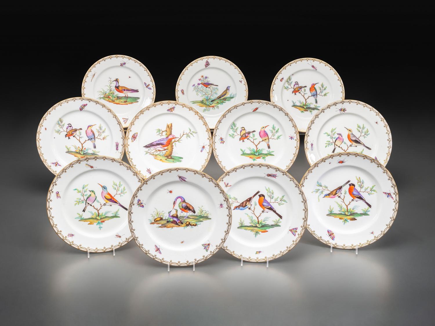 An English Parcel Gilt Bird and Insect Decorated Porcelain Partial Dinner Service