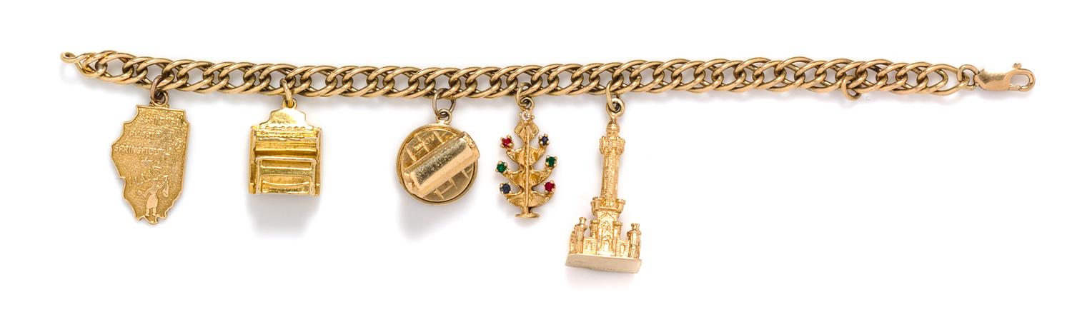 A 14 Karat Yellow Gold Charm Bracelet with Five Attached Charms, 24.70 dwts.