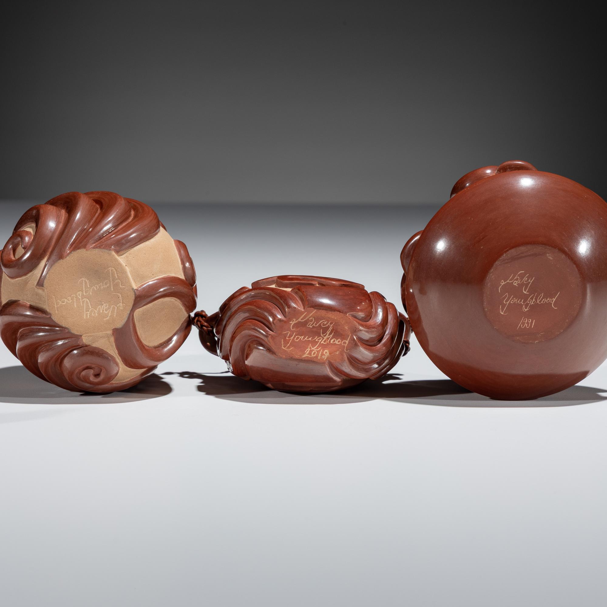 Red and Tan Carved Miniature Pottery