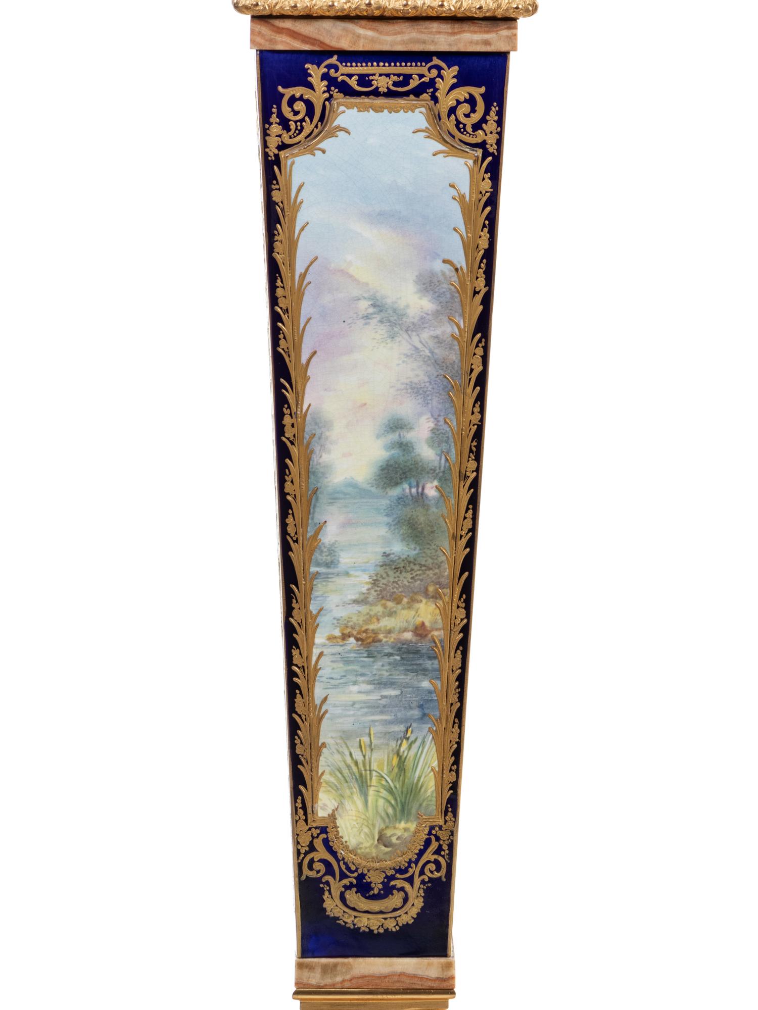 A Pair of Sèvres Style Gilt Bronze Mounted Painted and Parcel Gilt Porcelain and Onyx Pedestals