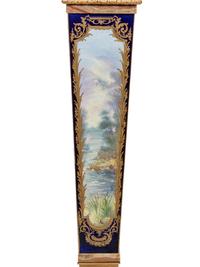 A Pair of Sèvres Style Gilt Bronze Mounted Painted and Parcel Gilt Porcelain and Onyx Pedestals