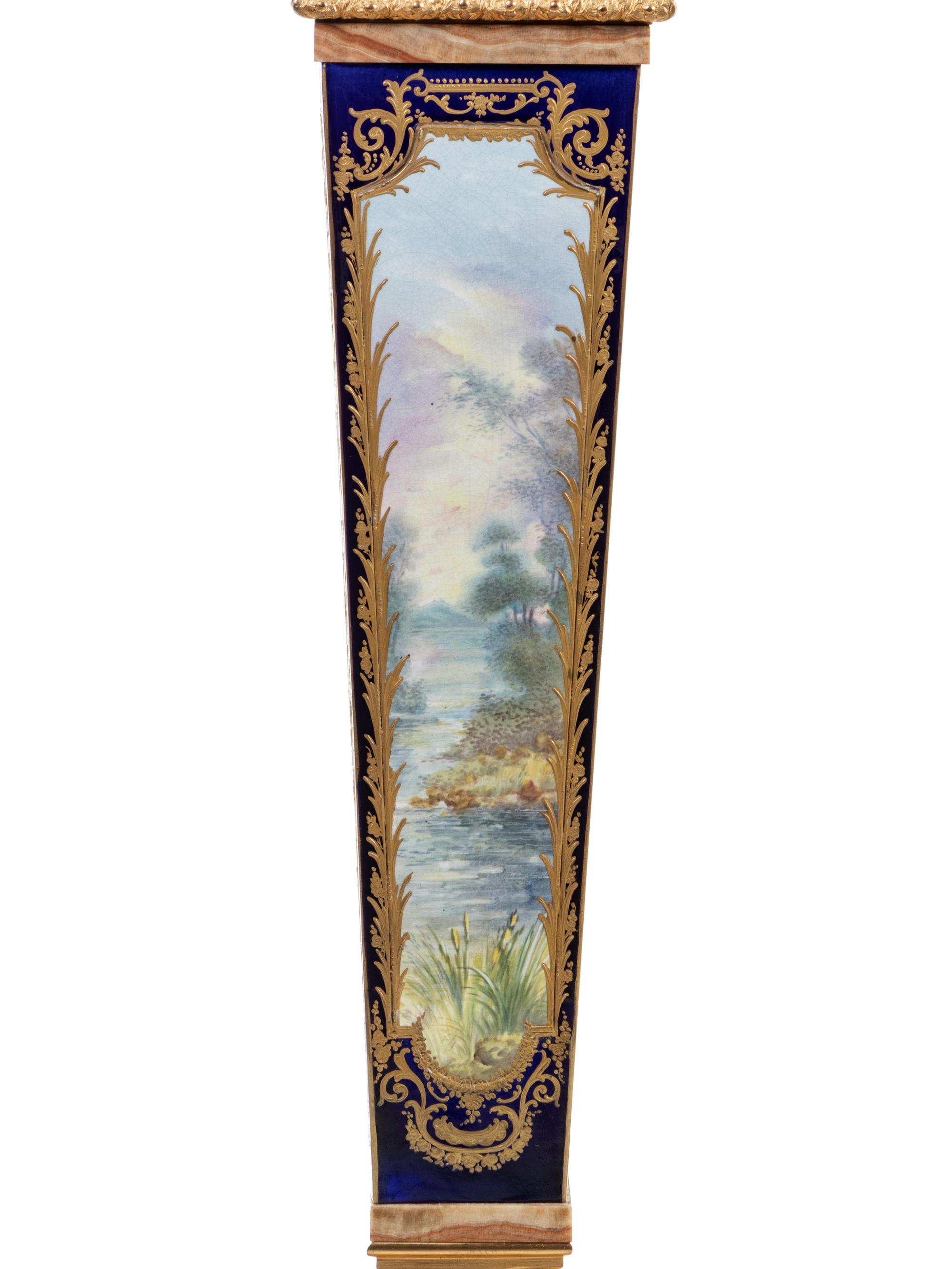 A Pair of Sèvres Style Gilt Bronze Mounted Painted and Parcel Gilt Porcelain and Onyx Pedestals