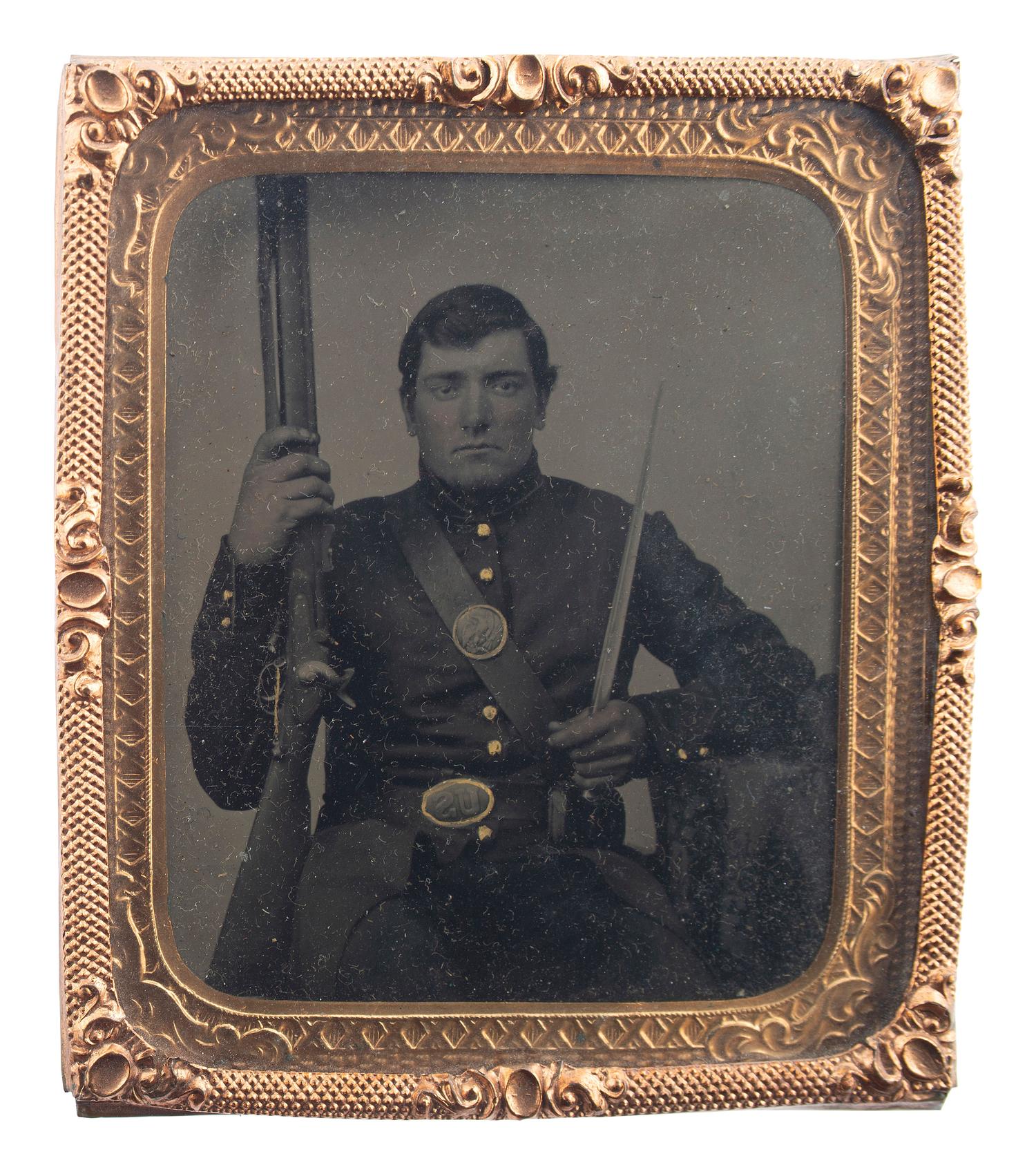 [CIVIL WAR]. Sixth plate tintype of a double-armed soldier tentatively identified as James M. Andrus, Company G, 1st New York Infantry.