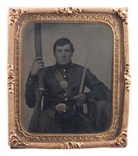 [CIVIL WAR]. Sixth plate tintype of a double-armed soldier tentatively identified as James M. Andrus, Company G, 1st New York Infantry.