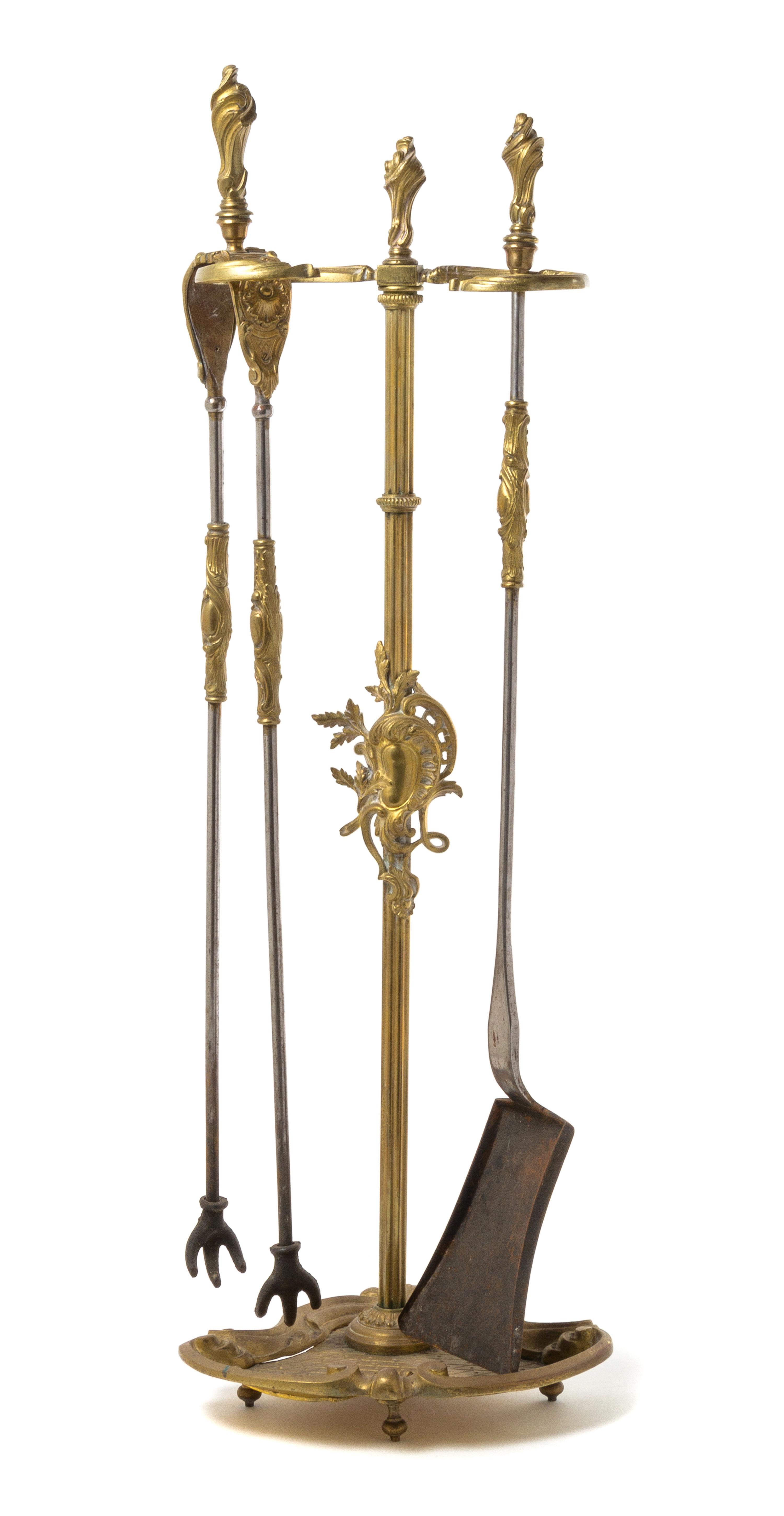 A Set of Louis XV Style Gilt Bronze Fireplace Tools Height 30 1/2 inches. — 19TH CENTURY