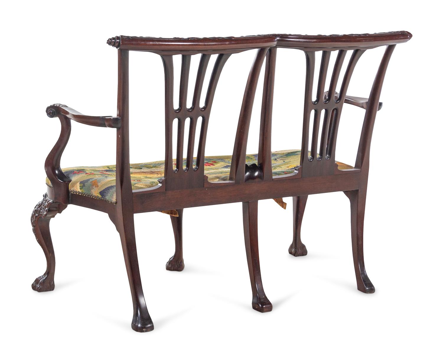 A Pair of Irish George II Style Carved Mahogany Double-Back Settees