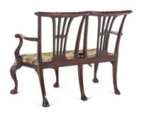 A Pair of Irish George II Style Carved Mahogany Double-Back Settees