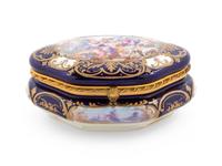 A Sèvres Style Painted and Parcel Gilt Porcelain Table Casket