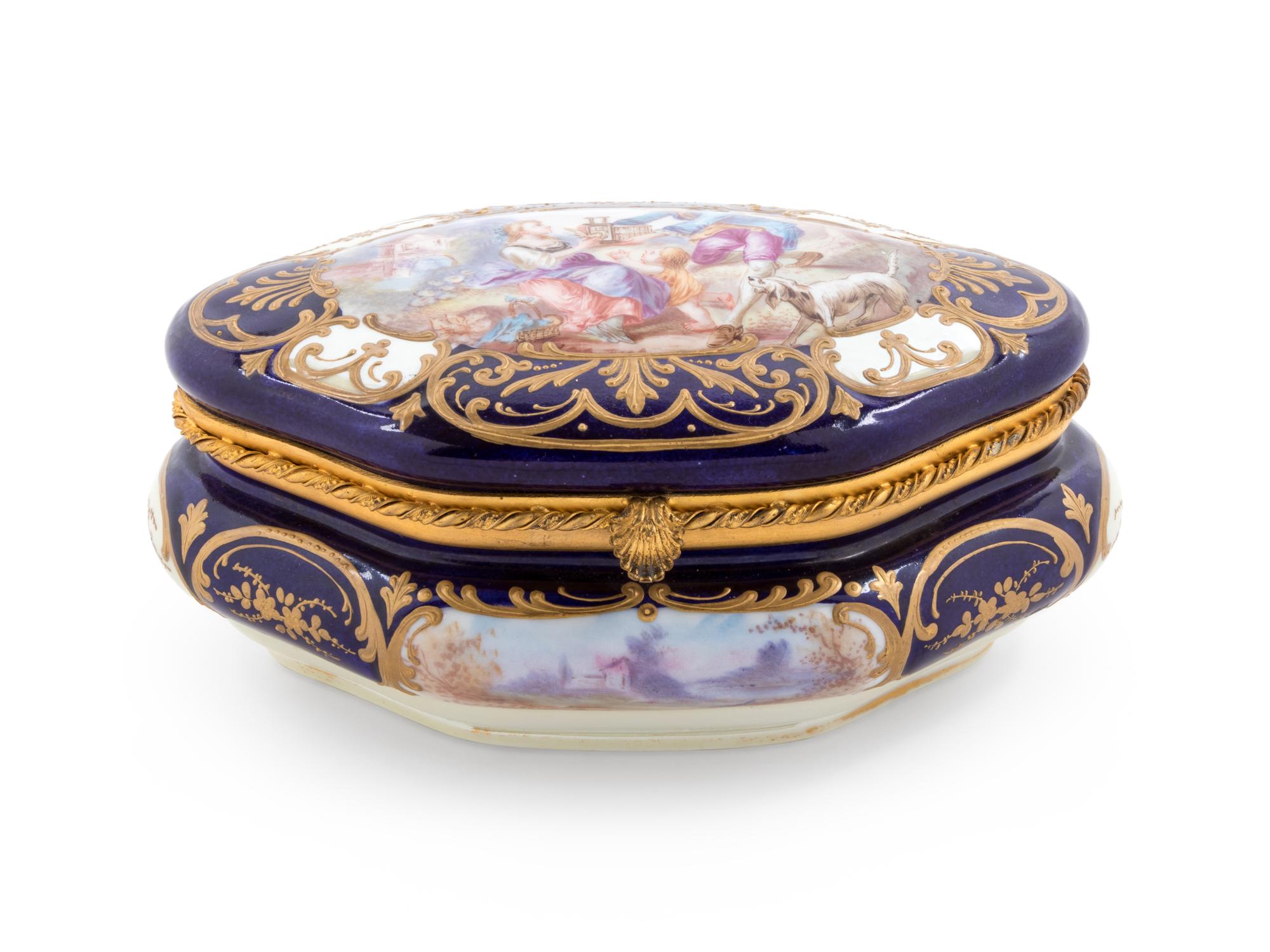 A Sèvres Style Painted and Parcel Gilt Porcelain Table Casket