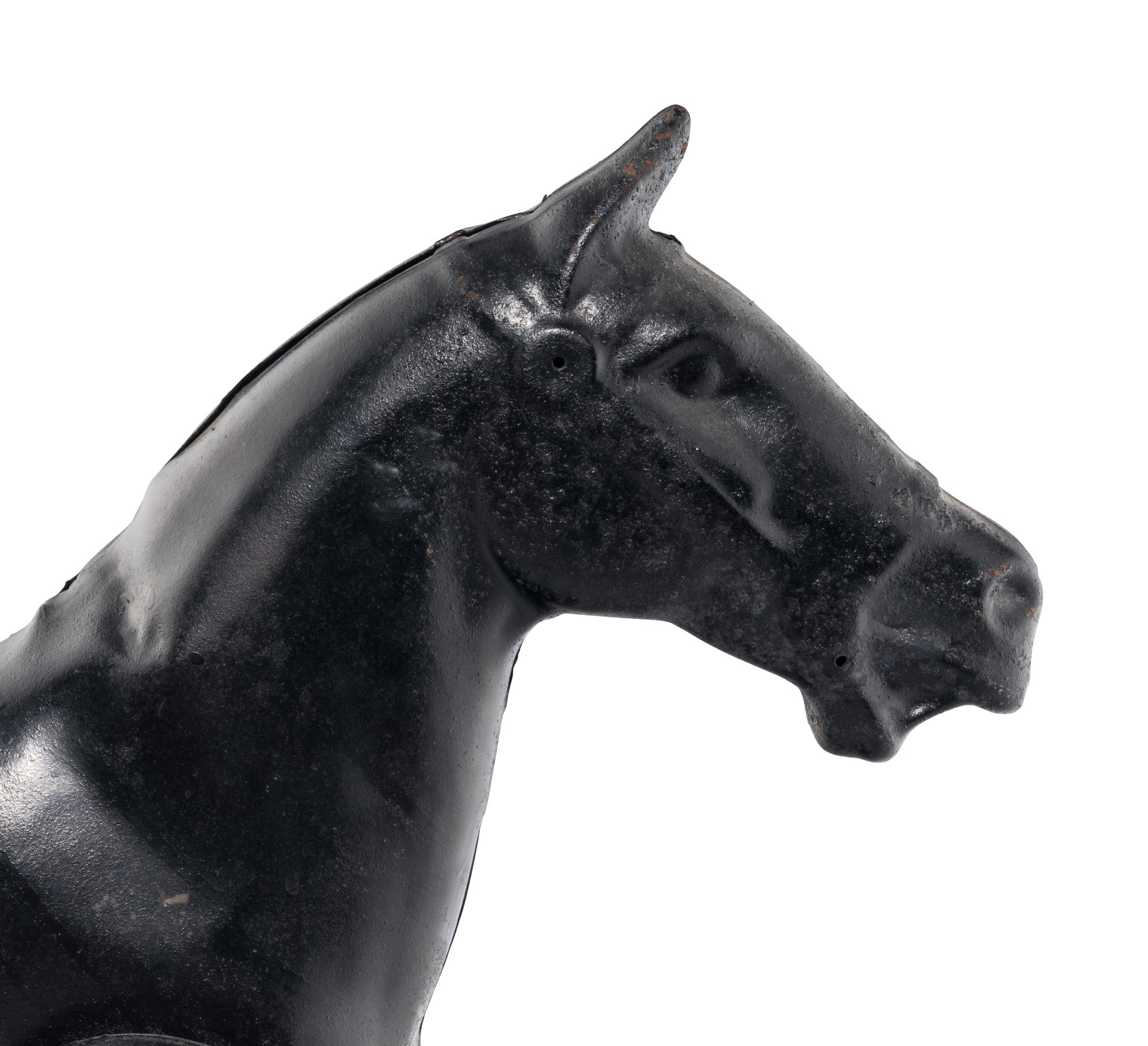 A Pressed Metal Horse Carousel Figure