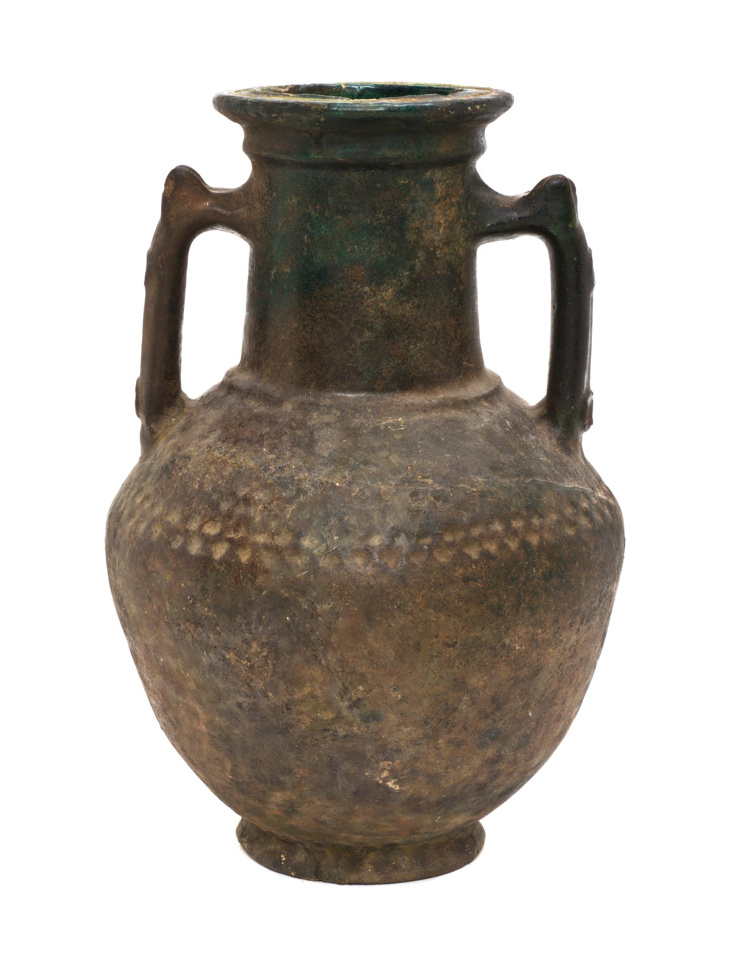 A Middle Eastern Earthenware Vase, Height 14 inches.