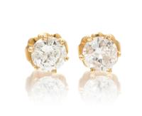 A Pair of 14 Karat Yellow Gold and Diamond Stud Earrings, 0.70 dwts.