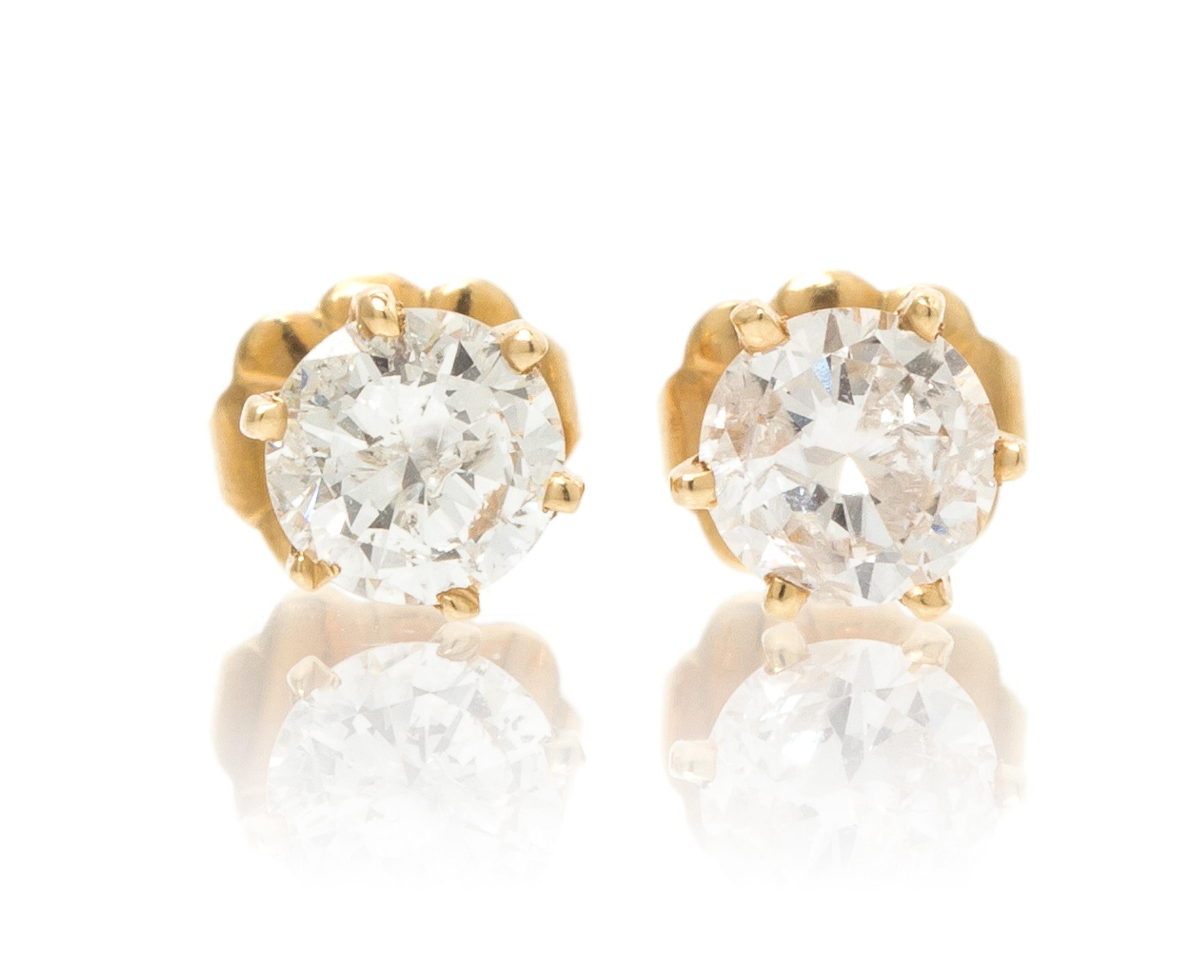 A Pair of 14 Karat Yellow Gold and Diamond Stud Earrings, 0.70 dwts.