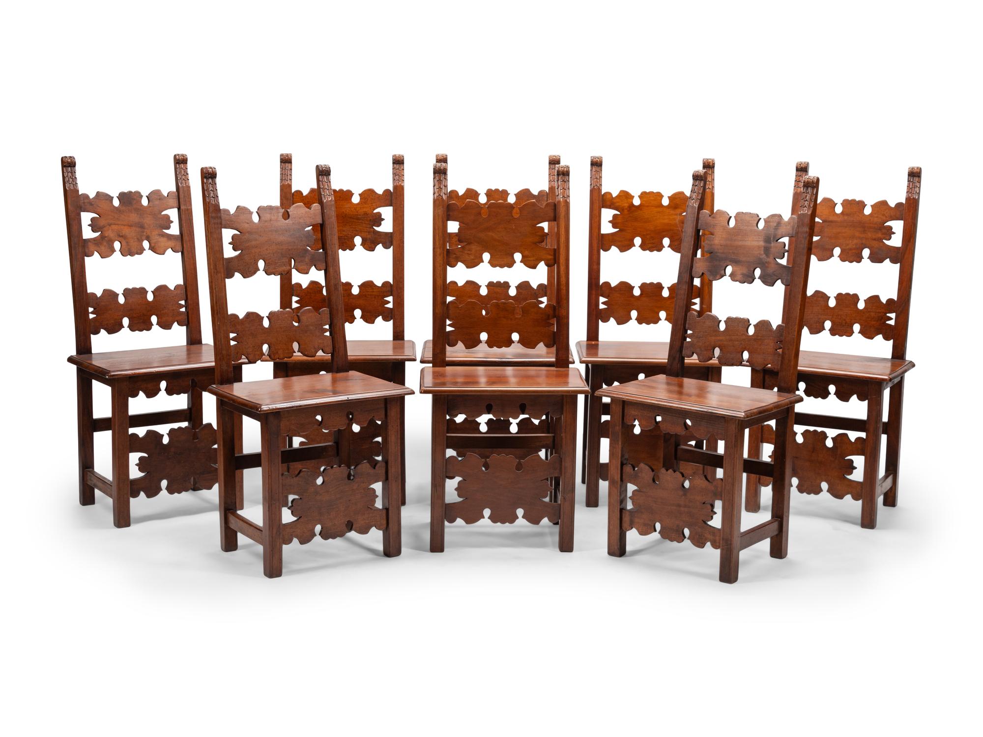 A Set of Eight Continental Baroque Style Walnut Chairs