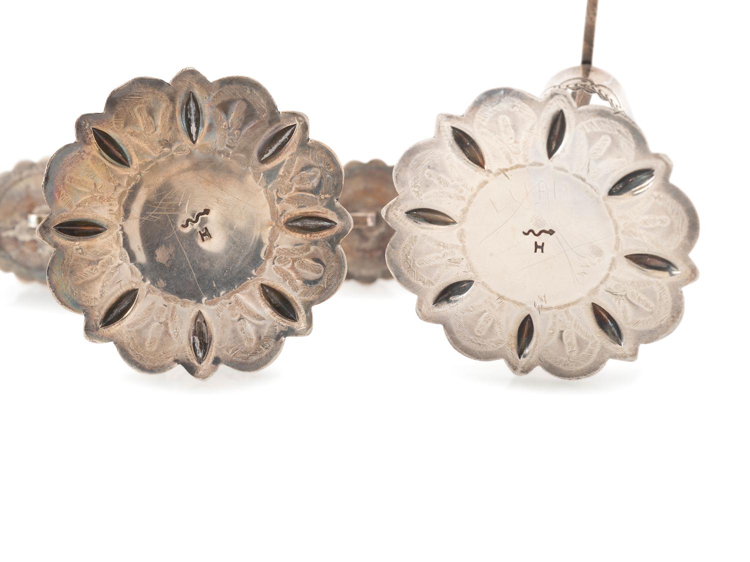 Pair of Heavily Stamped Silver Candelabras