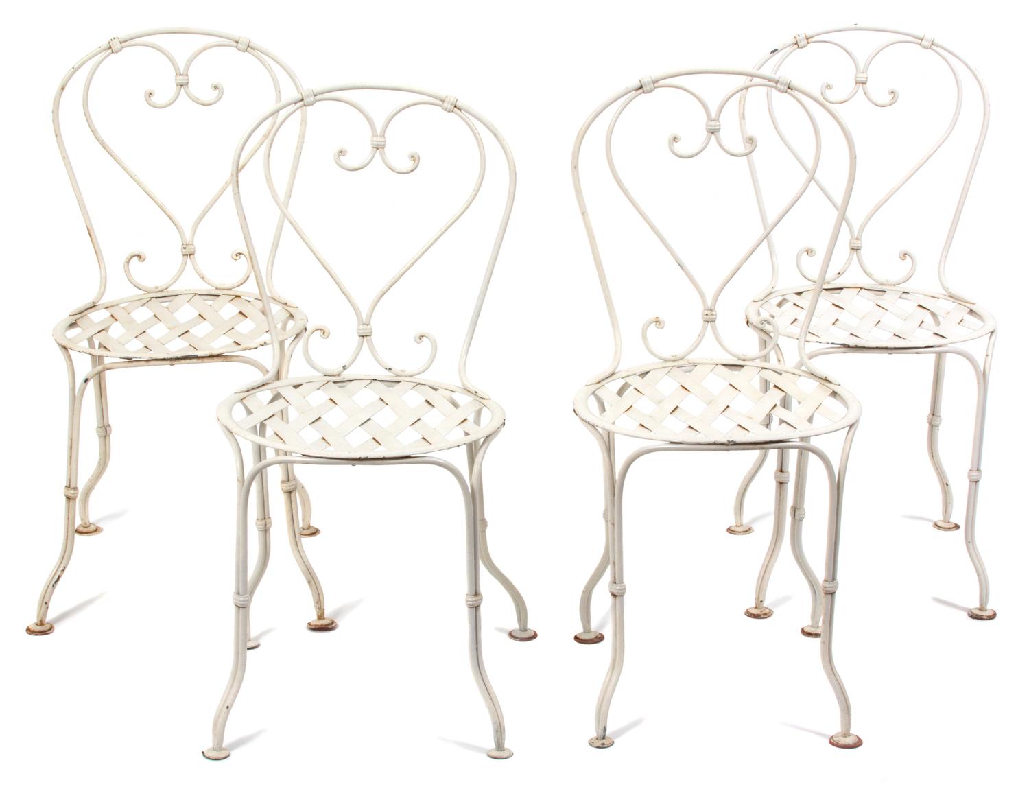 A Wrought Iron Painted Bistro Table and Four Chairs Height of table 28 3/4 x diameter 19 inches. — 20TH CENTURY