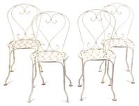 A Wrought Iron Painted Bistro Table and Four Chairs Height of table 28 3/4 x diameter 19 inches. — 20TH CENTURY