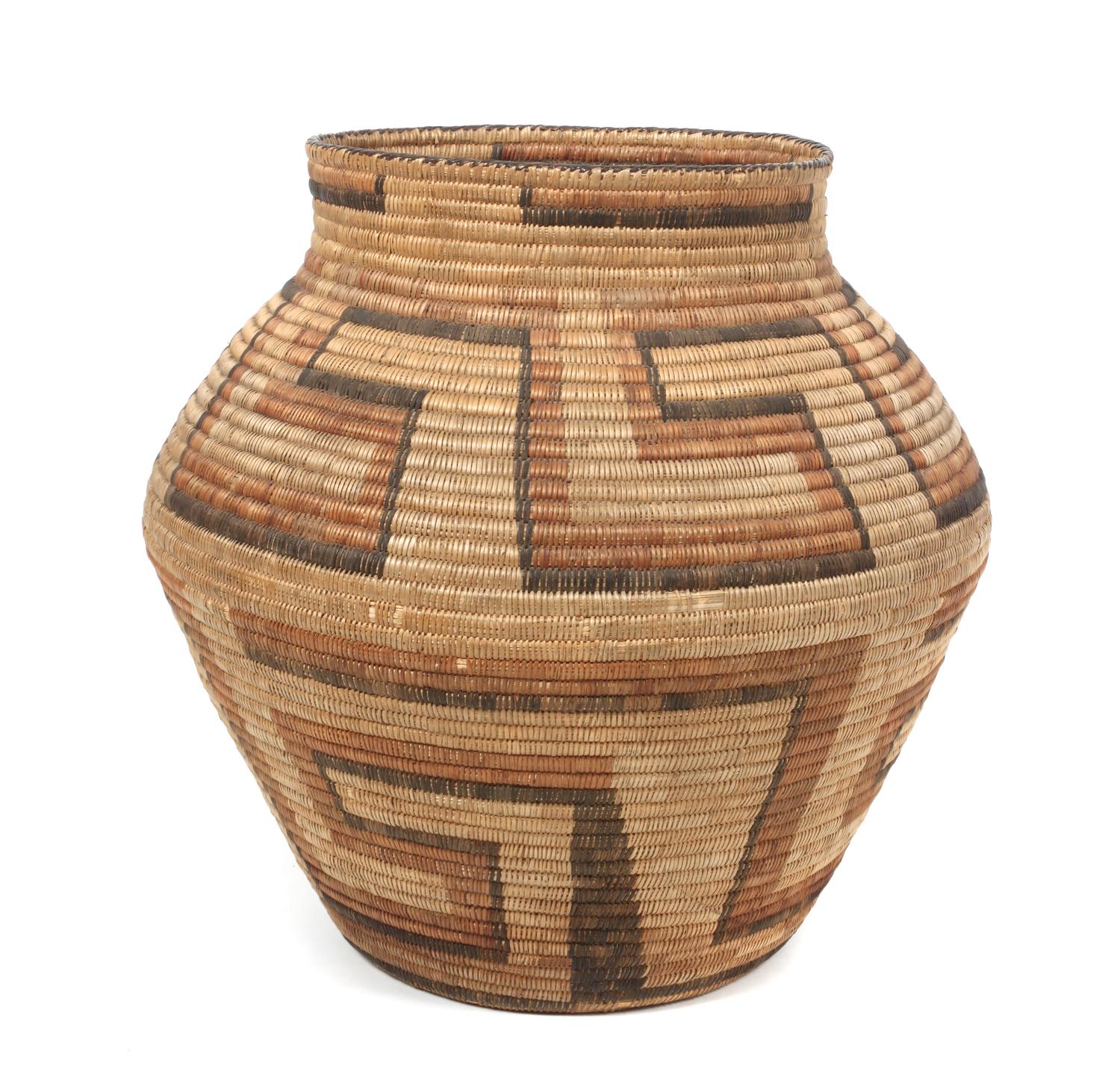 A Tohono O'odham Storage Basket Height 19 inches.