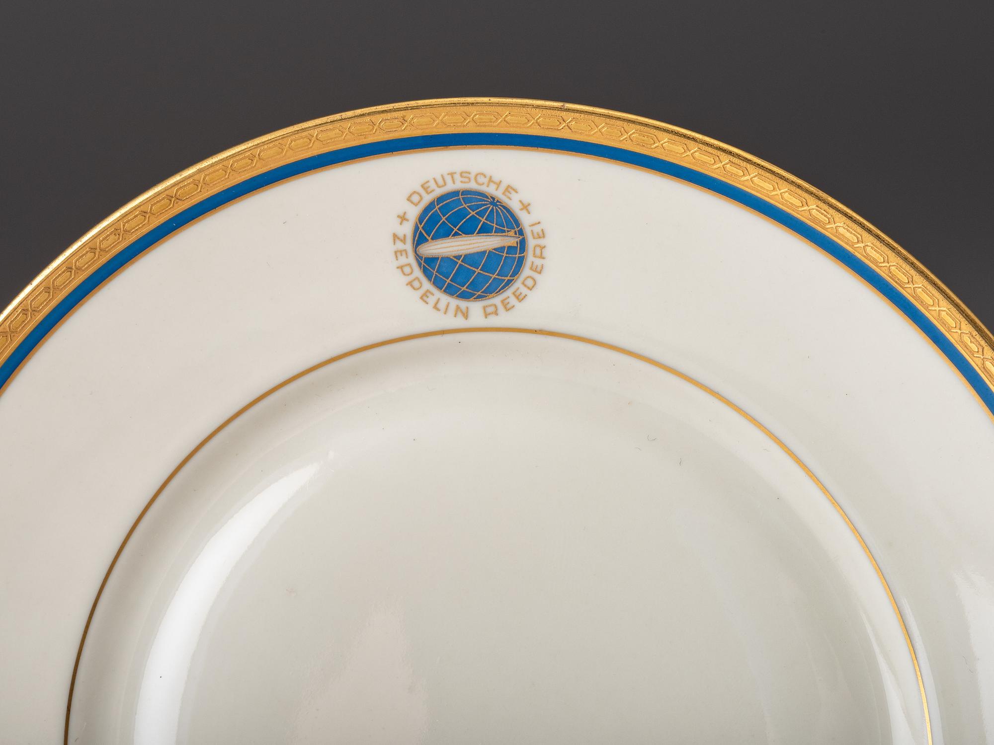 [TRANSPORTATION] - [ZEPPELIN]. Set of Deutsche Zeppelin-Reederei porcelain with dinner plates, salad plates, and sherbet glasses.