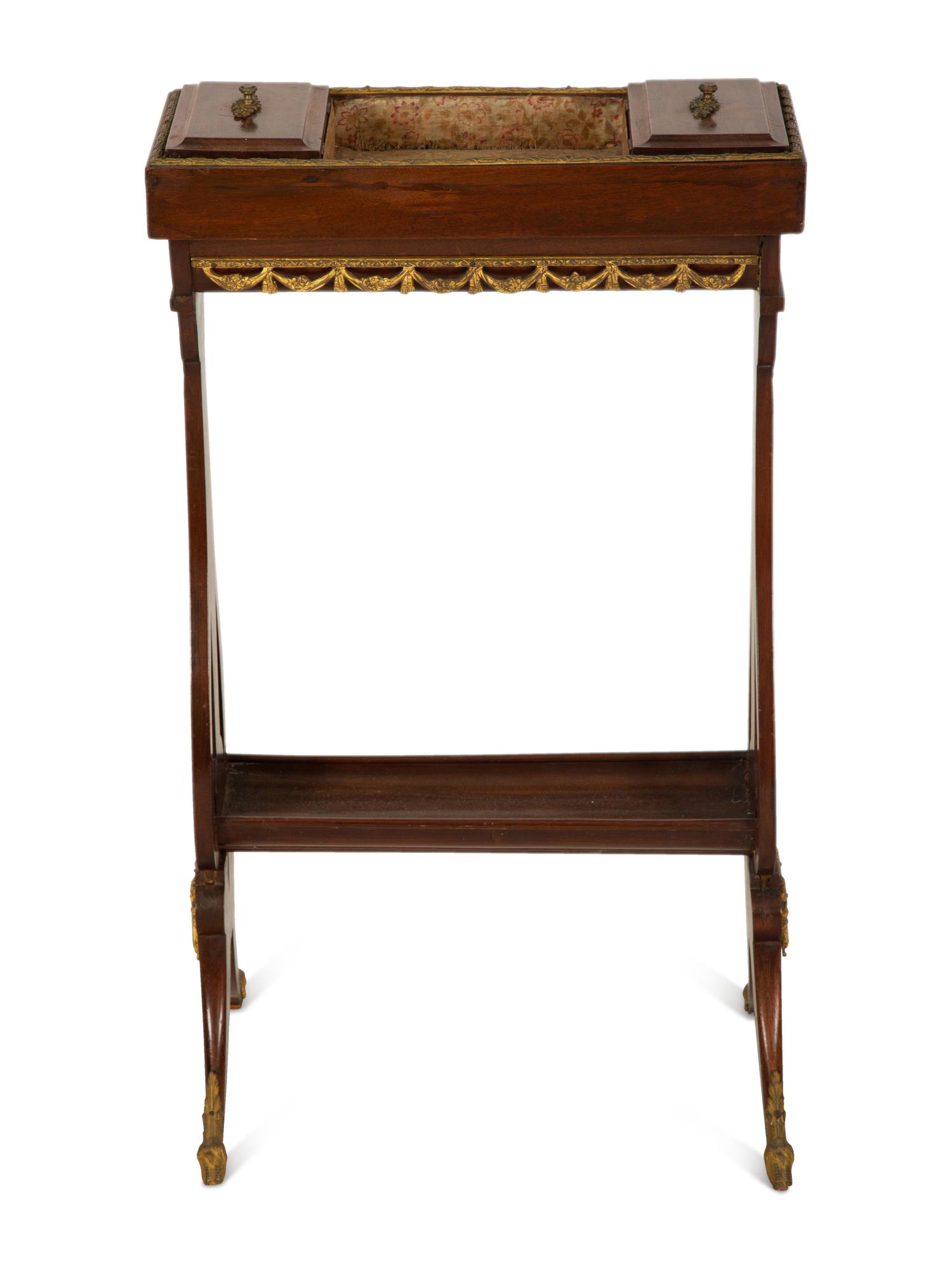 A French Empire Gilt Metal Mounted Mahogany Work Table