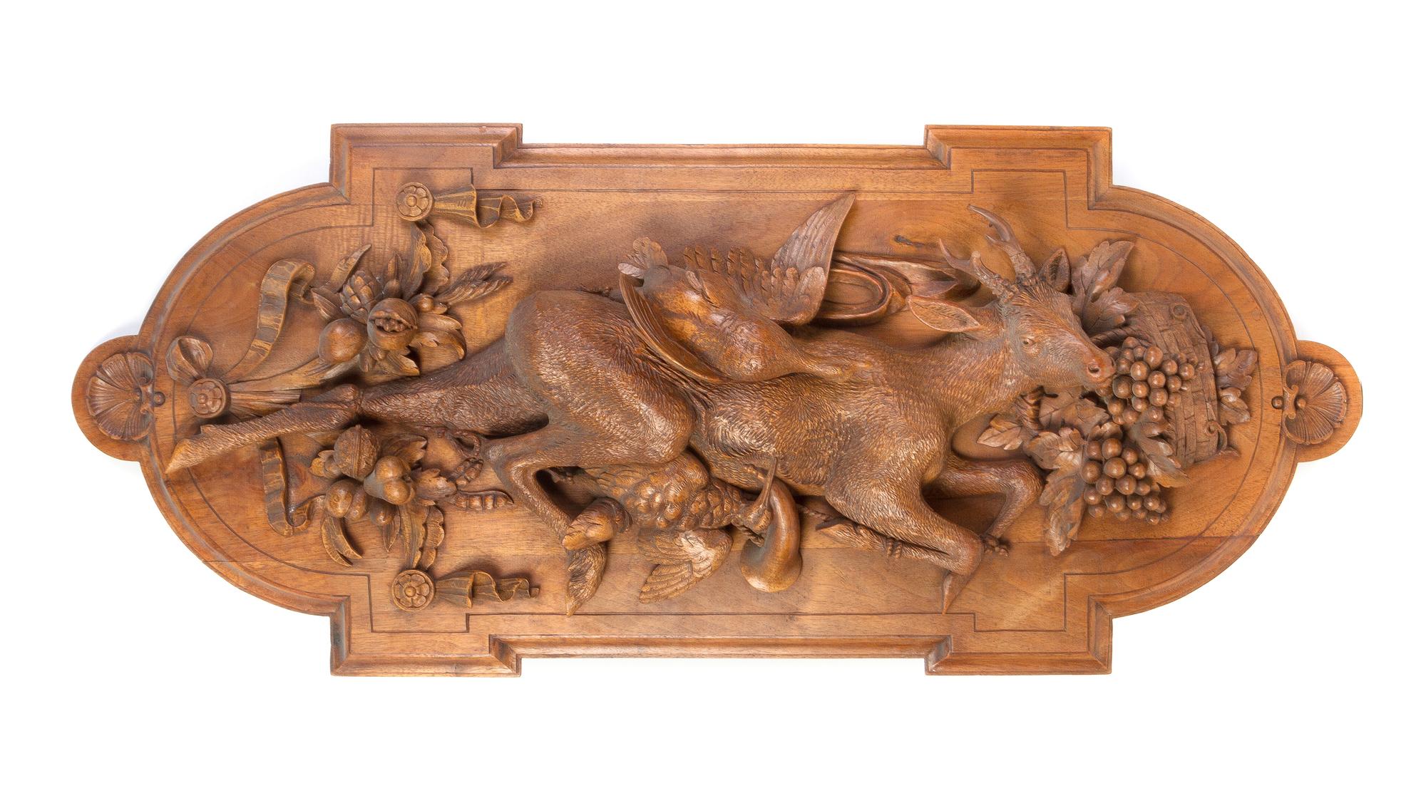 A Continental Carved Walnut Game Trophy, Height 39 1/2 inches.