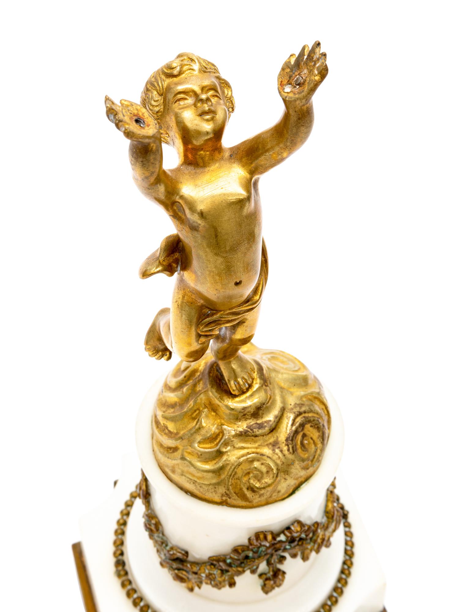A Gilt Bronze and Marble Putto Ornament