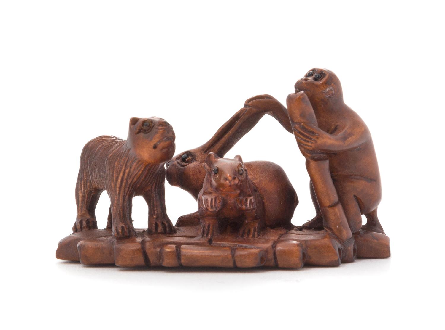 A Carved Wood Netsuke — SIGNED MASAKAZU, 19TH CENTURY