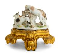 A German Porcelain Hunting Dog and Wolf Group on a Gilt Bronze Stand