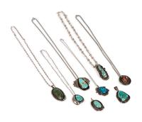An Assortment Navajo Silver, Coral, and Turquoise Pendants