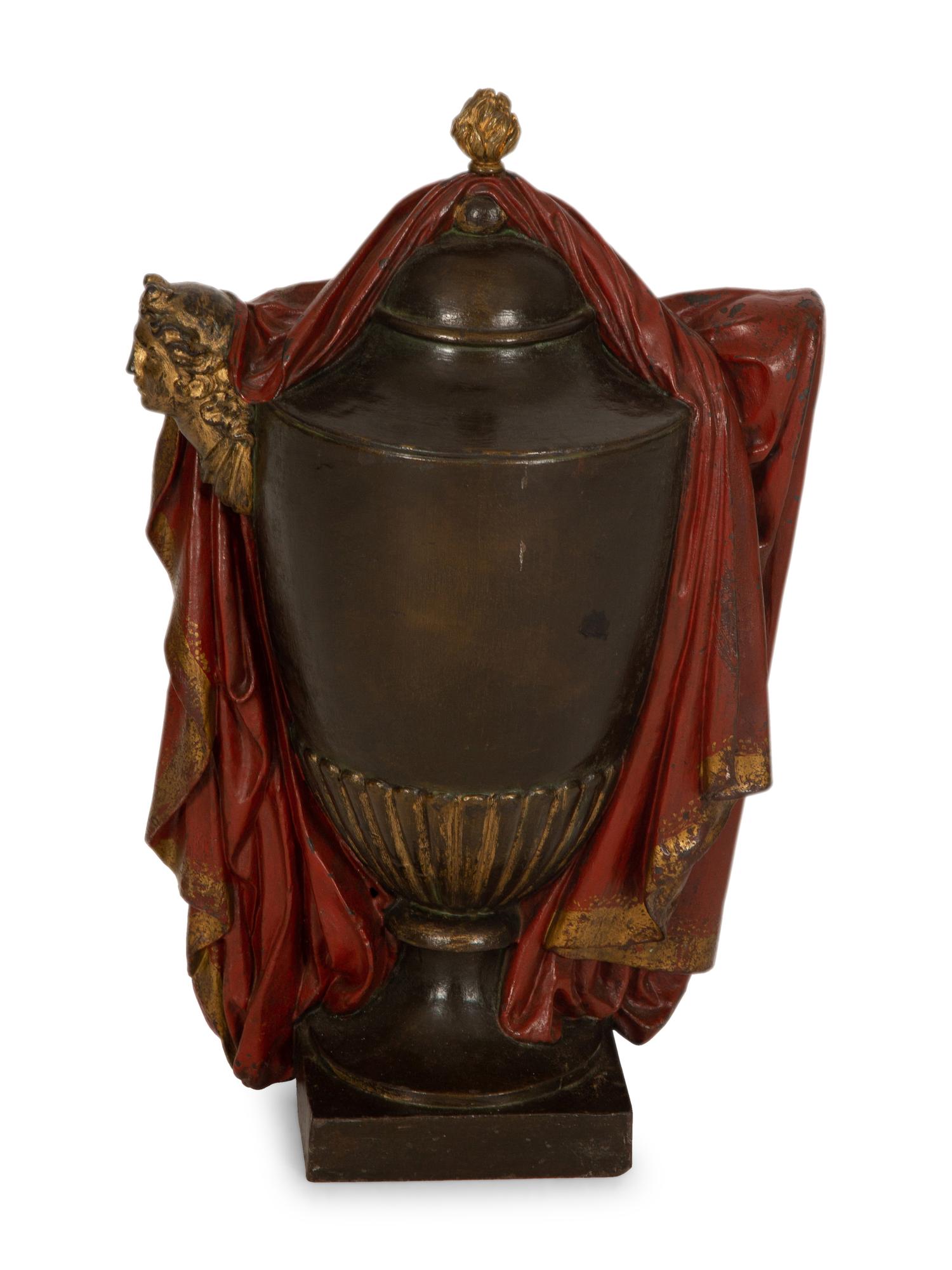 A Regency Style Painted and Parcel Gilt Cast Iron Urn