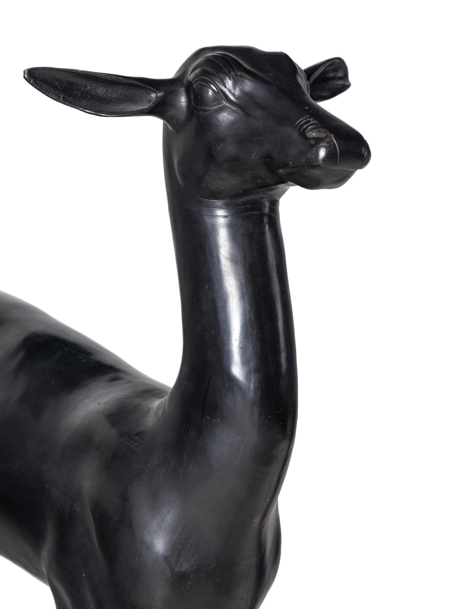 A Pair of Bronze Models of Pompeiian Deer on Marble Plinths