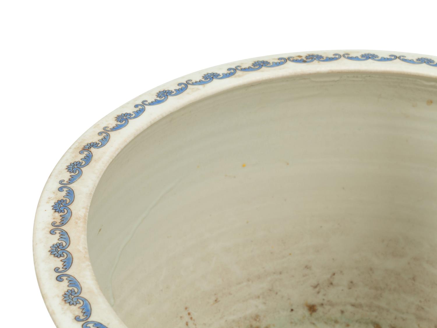 A Chinese Porcelain Jardinière on a Wood Stand
