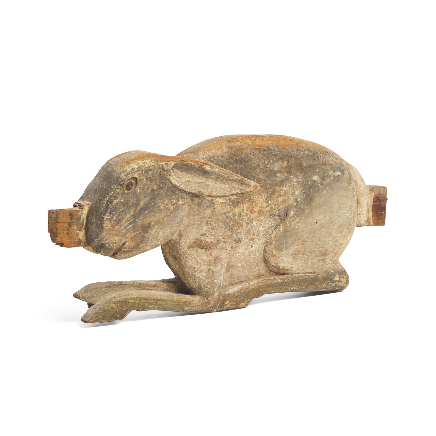 A Carved and Painted Figure of a Rabbit