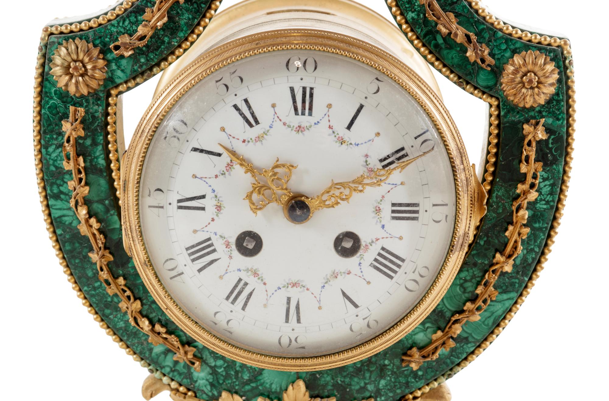 A Louis XIV Style Gilt Metal Mounted Malachite Veneered Harp Clock