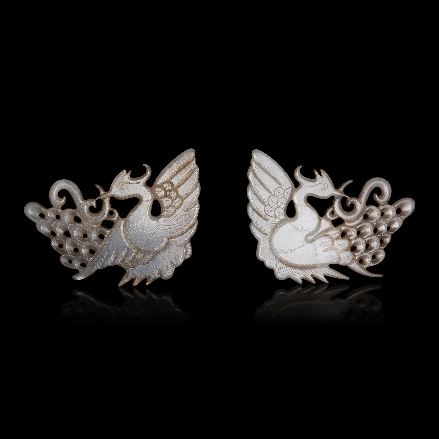 A Pair of Chinese Pale Celadon Jade 'Peacock' Hat Ornaments, Jin Dynasty 金 白玉孔雀珮一對