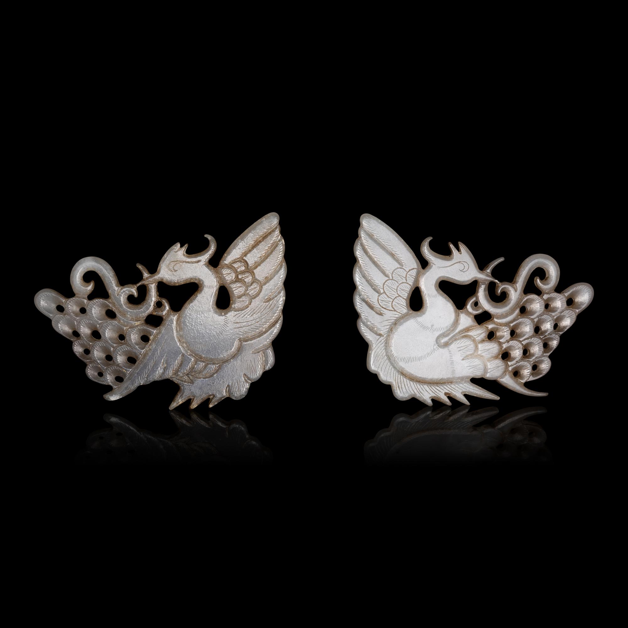 A Pair of Chinese Pale Celadon Jade 'Peacock' Hat Ornaments, Jin Dynasty 金 白玉孔雀珮一對