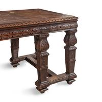 An Italian Carved Oak Writing Table