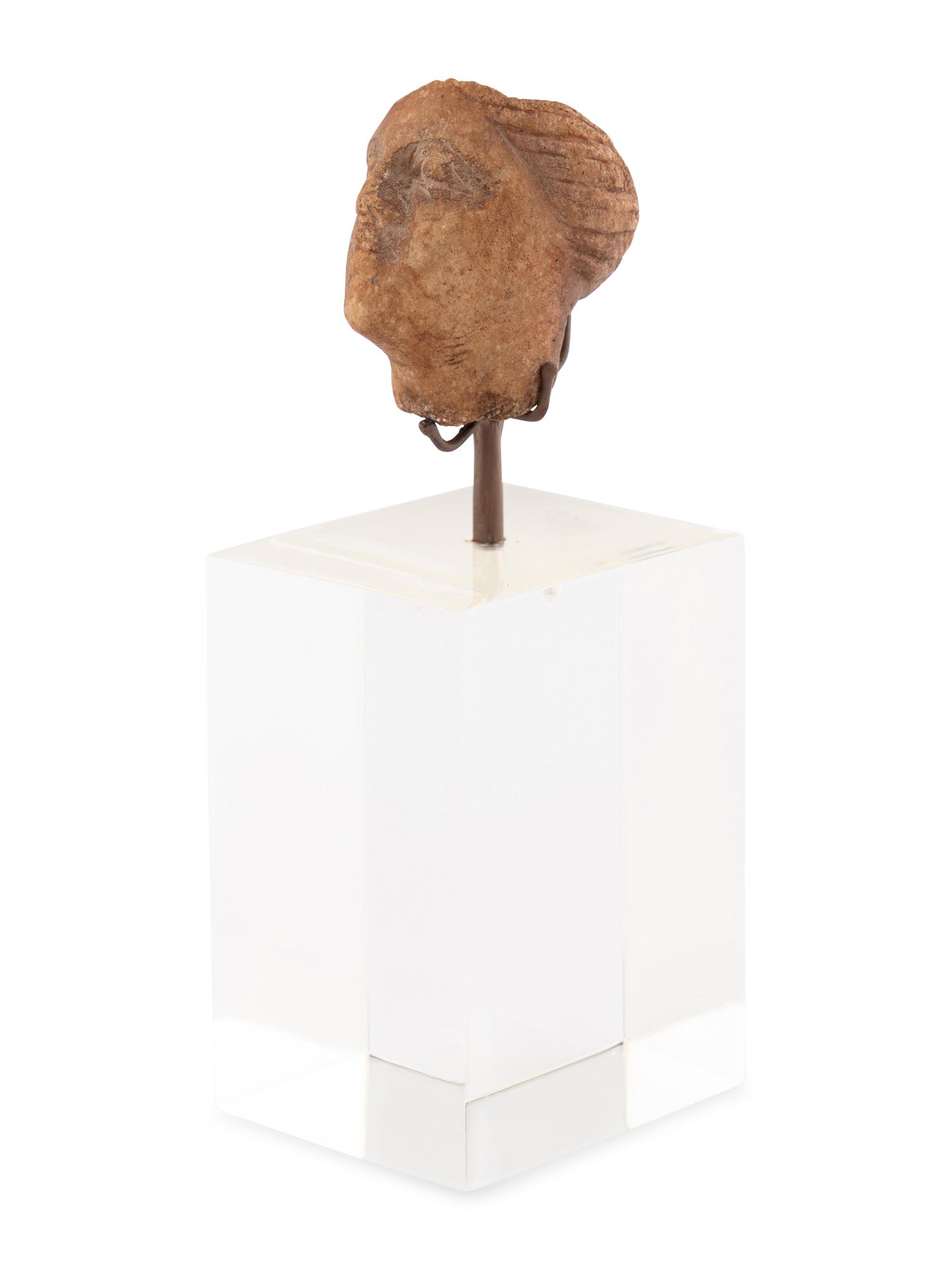 A Roman Stone Head of a Woman