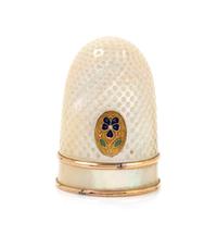 A French Palais Royal Mother-of-Pearl Thimble, Late 18th/Early 19th Century, the domed body with an applied gilt metal oval plaque bear