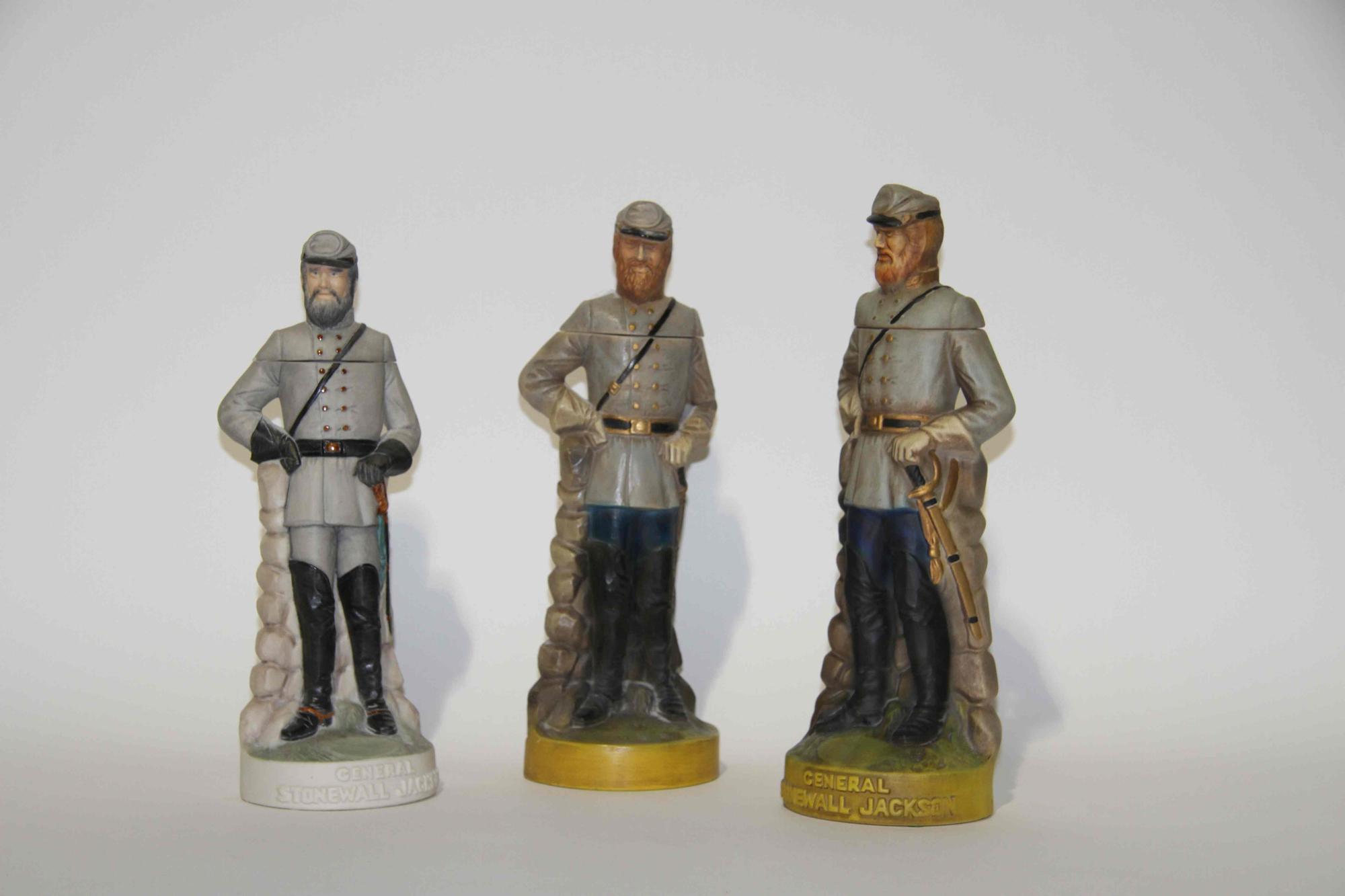 A Group of Eight Figural Pottery Bottles Height of tallest 12 1/4 inches.