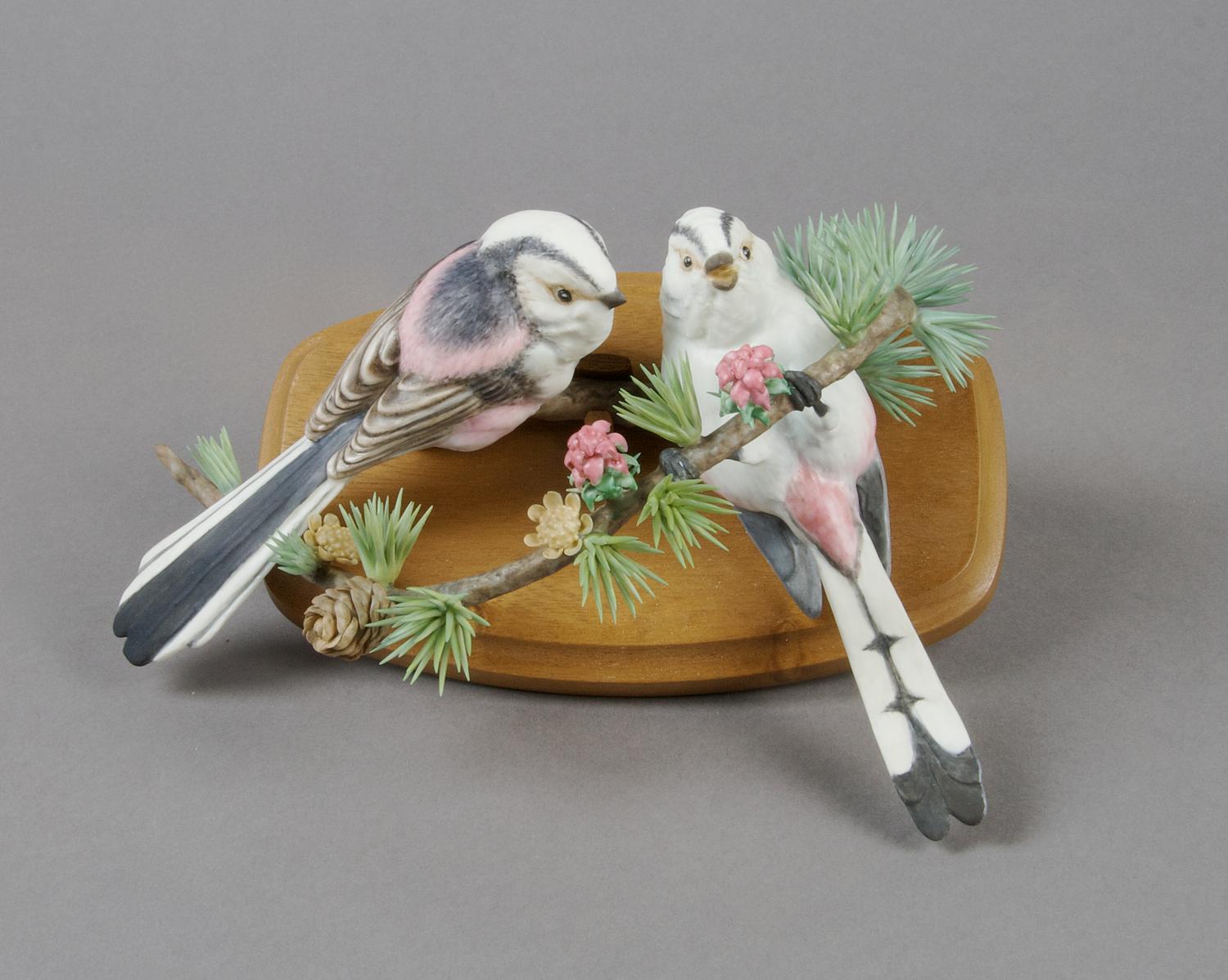 A Royal Worcester Dorothy Doughty Figural Group, Long Tailed Tits. Length 8 1/2 inches.